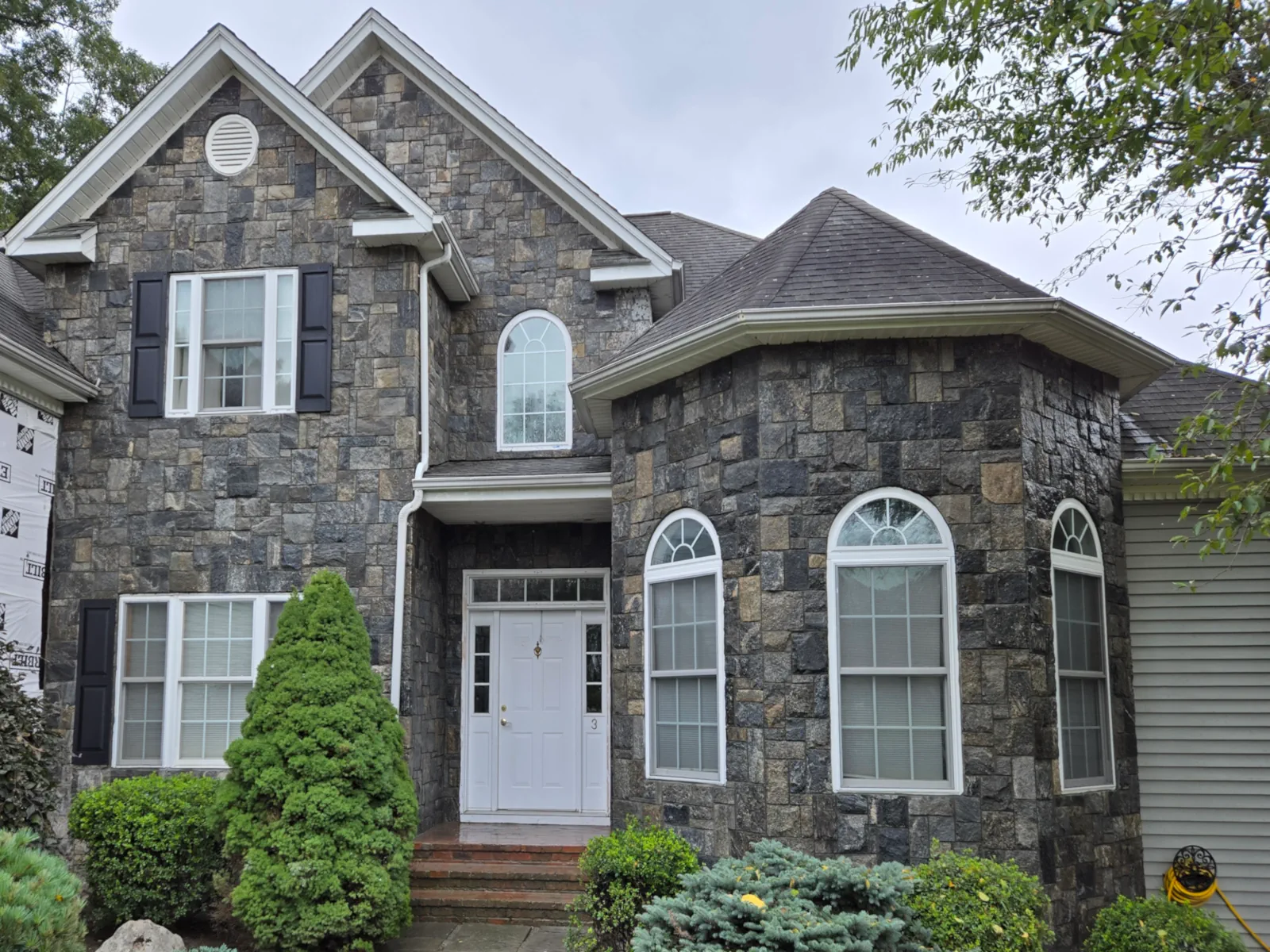 Connecticut masonry project with stone, pavers, and bluestone work